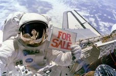 800px-NASA_astronaut_with_for_sale_sign_on_EVA_-_to_retrieve_sattlite.jpg