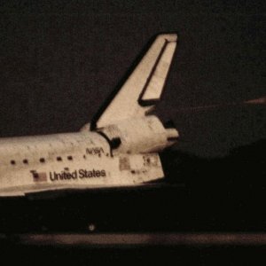 Space shuttle landing from the VIP viewing site. It was before sunrise, hence the dark bits and the shaky background :).