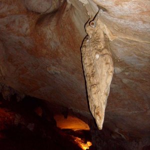 Stalactite and climbing bolt that looked like a hummingbird